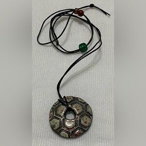 Black Cord Necklace with Green Bead and Patterned Pendant